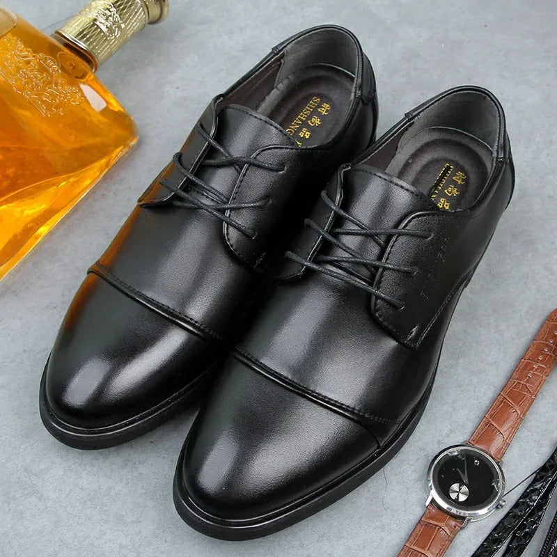 Men's black formal lace-up shoes with decorative stitching and horse buckle detail on rubber sole