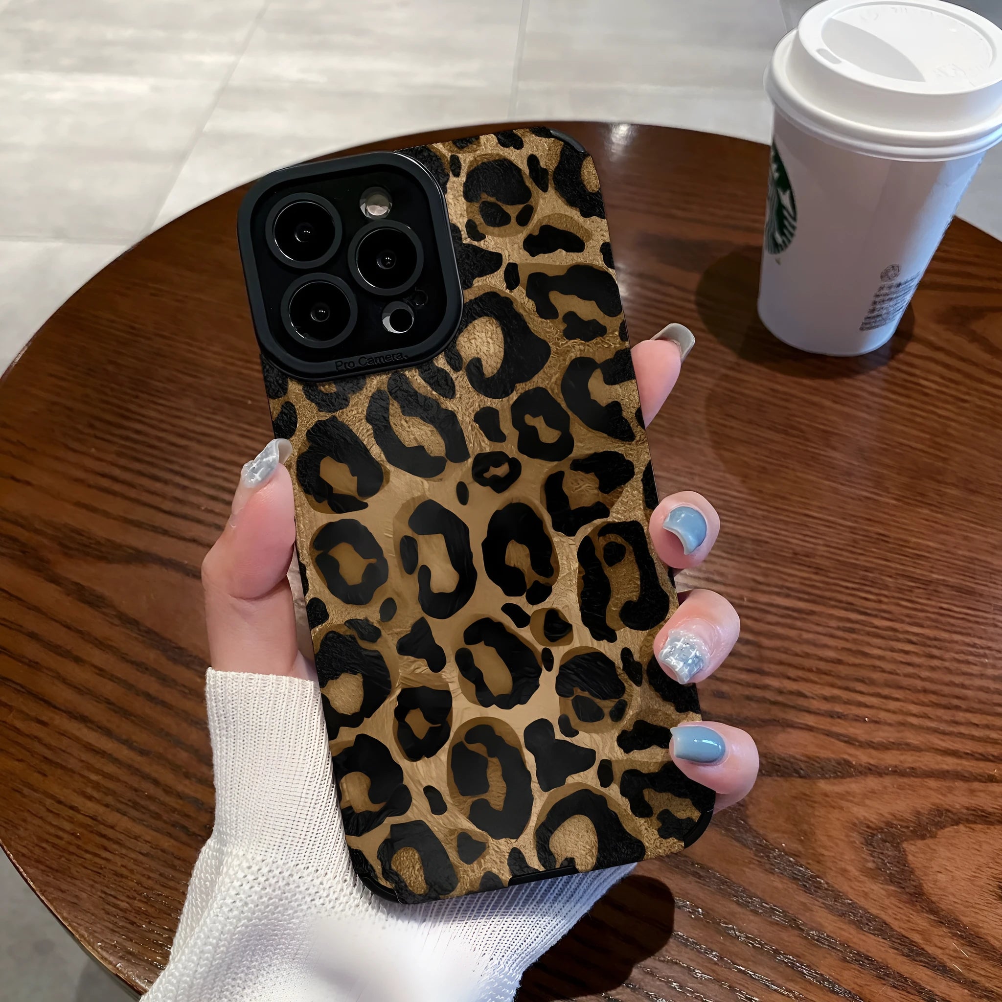 Gold leopard print all-inclusive imitation leather phone case for iPhone on a white background