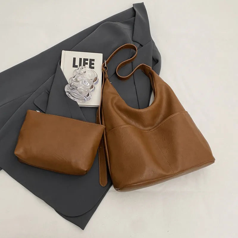 Women's large-capacity soft PVC shoulder bag bucket shape with stitching in beige white colour