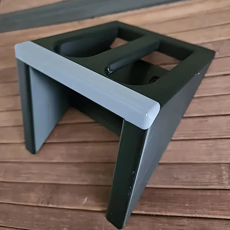 Black punk-style plastic pistol display stand measuring 10.85 by 7.6 centimetres.