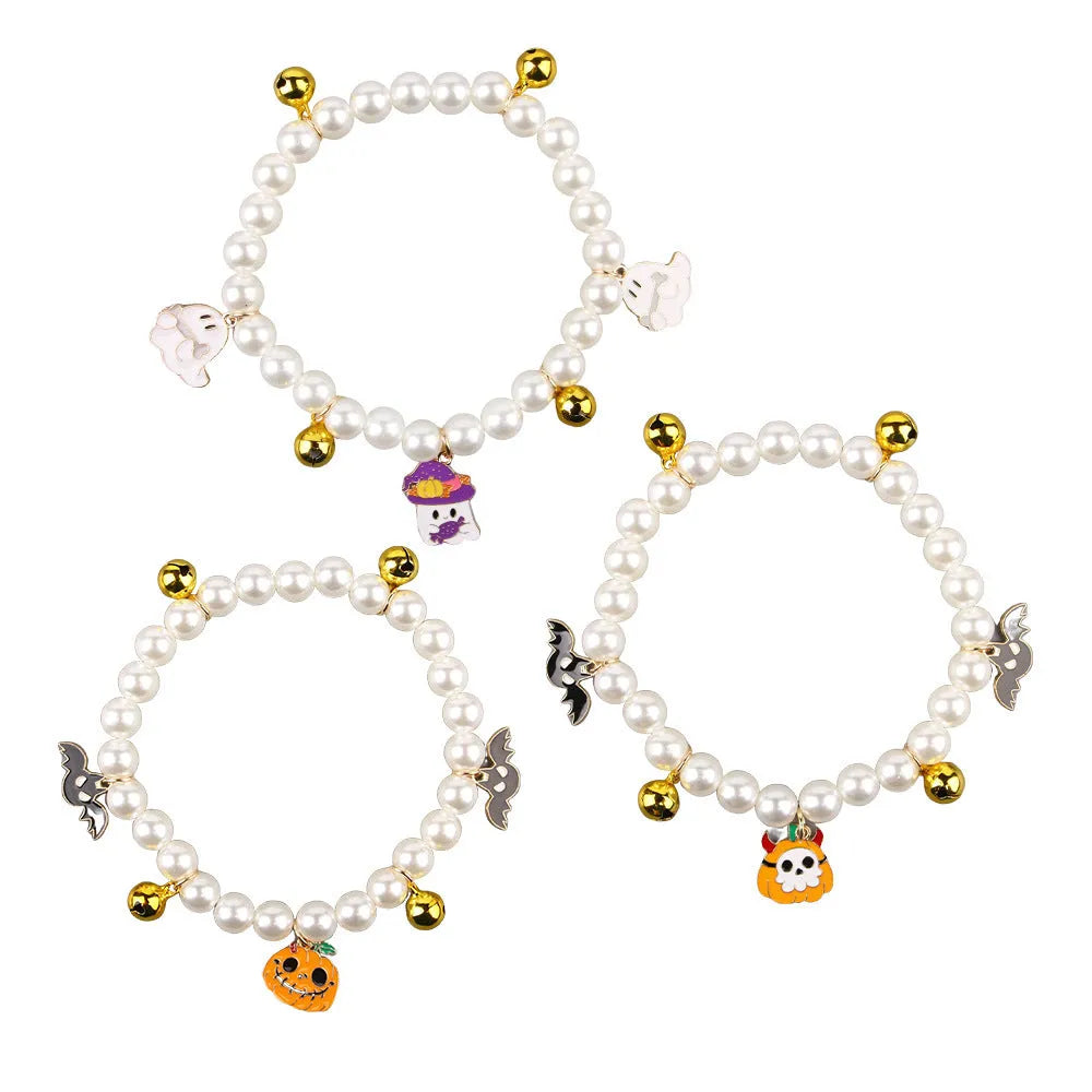 Halloween cat collar with simulated pearls and a choice of purple ghost, skull, or smiling pumpkin print.