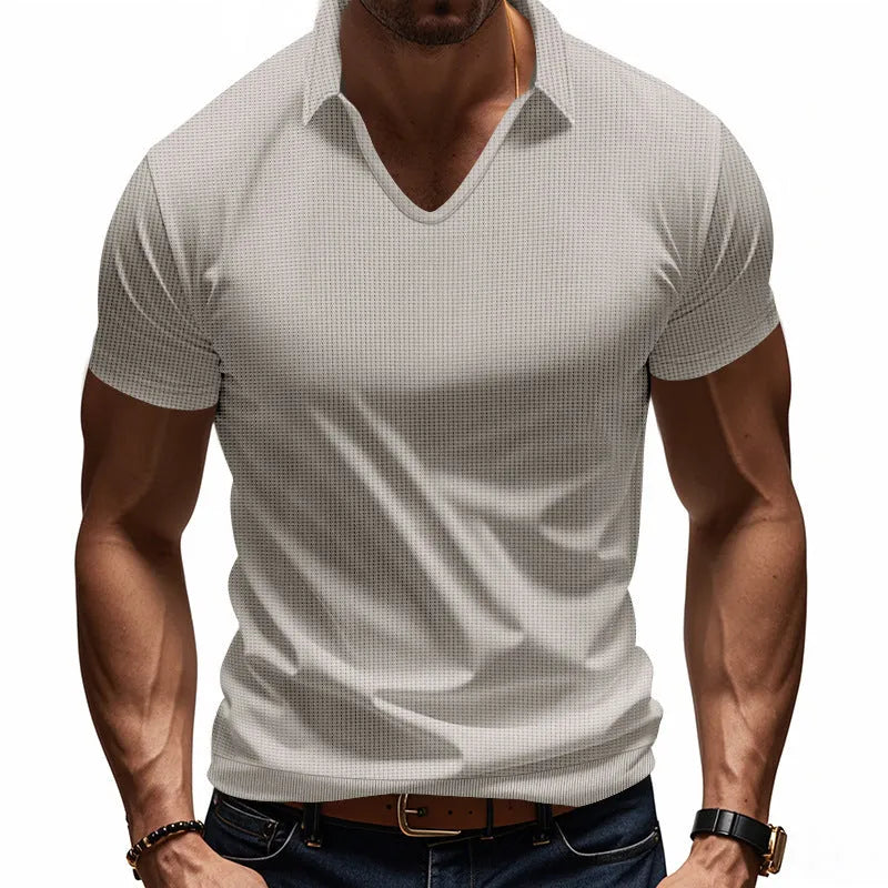 Men's loose-fitting light blue V-neck short-sleeved cotton blend t-shirt laid flat.