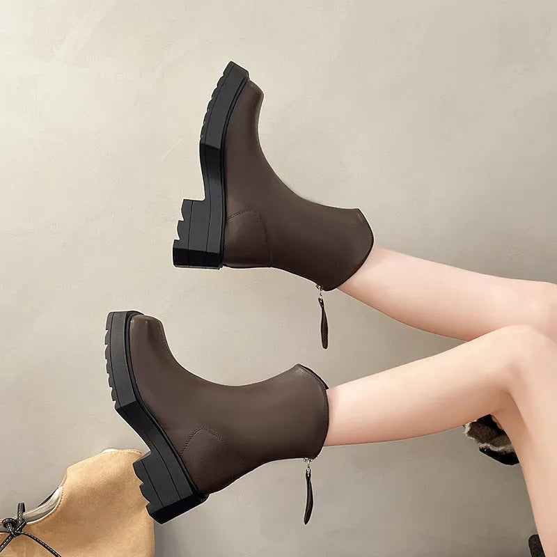 Black square toe platform Martin boots for women with a back zipper and a mid-calf height.