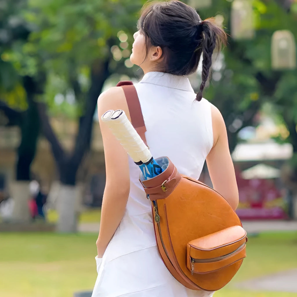 Retro leather badminton bag for women with a single shoulder strap, shown in purplish white colour.