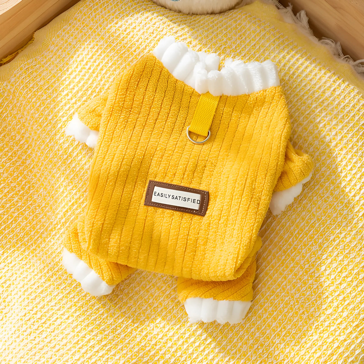 Yellow ribbed fleece pet jumpsuit with white ruffled cuffs and leash ring for cats and small dogs.