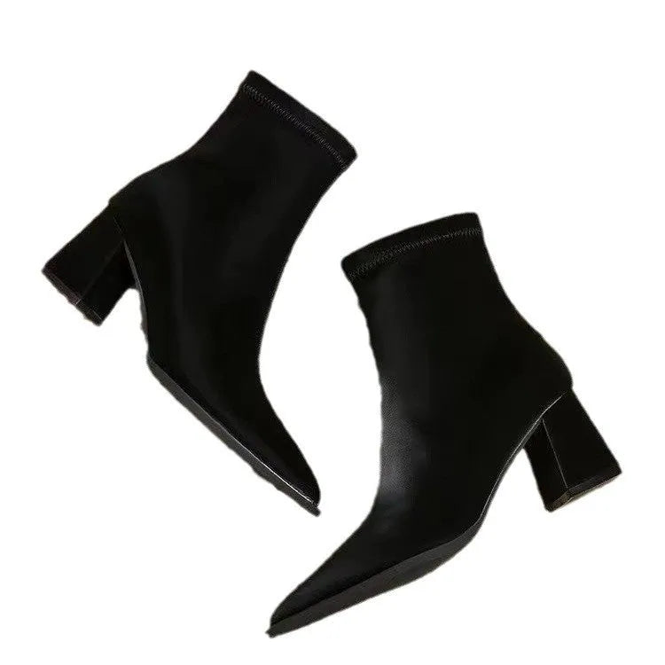 Women's khaki pointed toe Martin boots with a wedge heel on a white background.