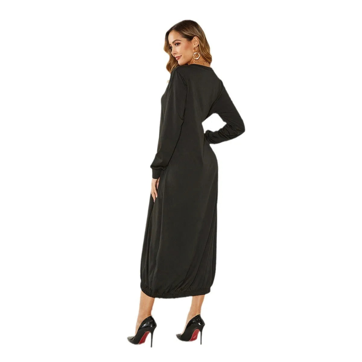 Black lace-up crew neck loose knit lantern dress on a model, showing the lantern silhouette.