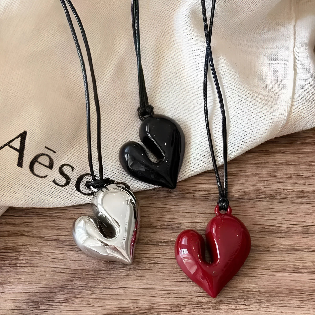 Black rope halter love necklace with acrylic pendant, cross chain style, and adjustable fit for women