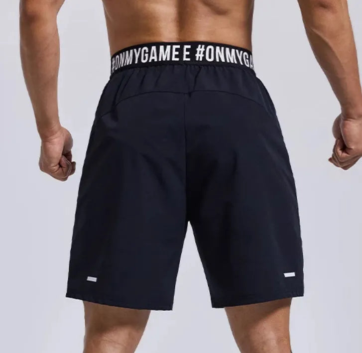 Men's loose black sports shorts with an elastic waistband and printed letter design.