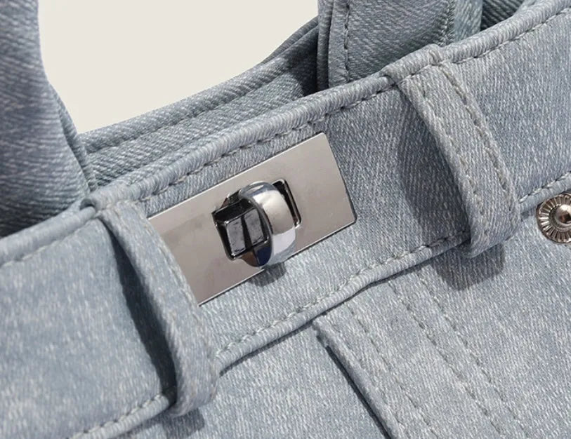 Women's denim shoulder bag in casual style with soft PU construction and polyester lining