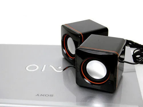 Small square black USB-powered 2.0 computer speaker for PC desktop.