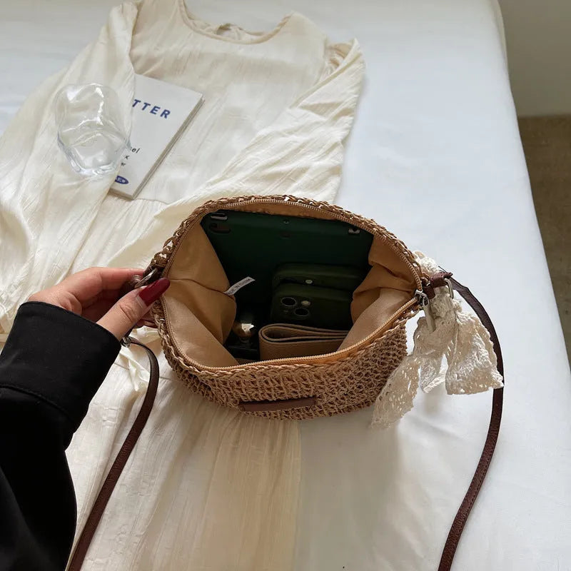 Women's woven straw messenger bag with hollowed pattern in khaki colour with zipper compartment