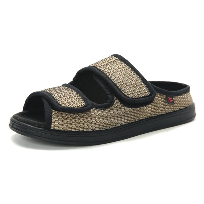 Wide adjustable foam bottom slippers with mesh upper in black, side view