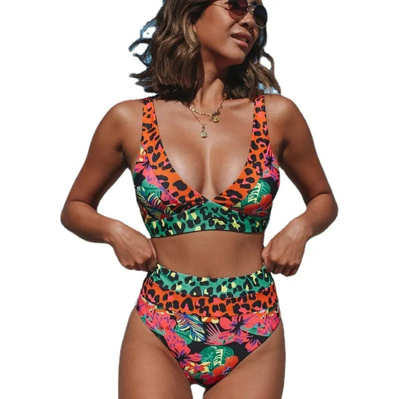Women's high-waist floral print bikini set in blue on a mannequin.