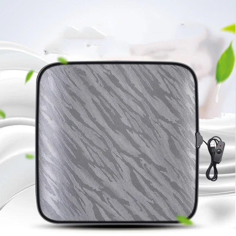 Car heating square cushion in black, approximately 45x45 cm, with USB cable and switch.