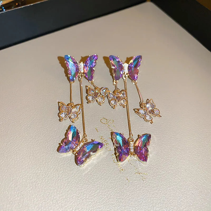 Silver Needle Crystal Flowers Butterfly Tassel Earrings in blue purple with a 5.5cm drop on a hypoallergenic alloy post.