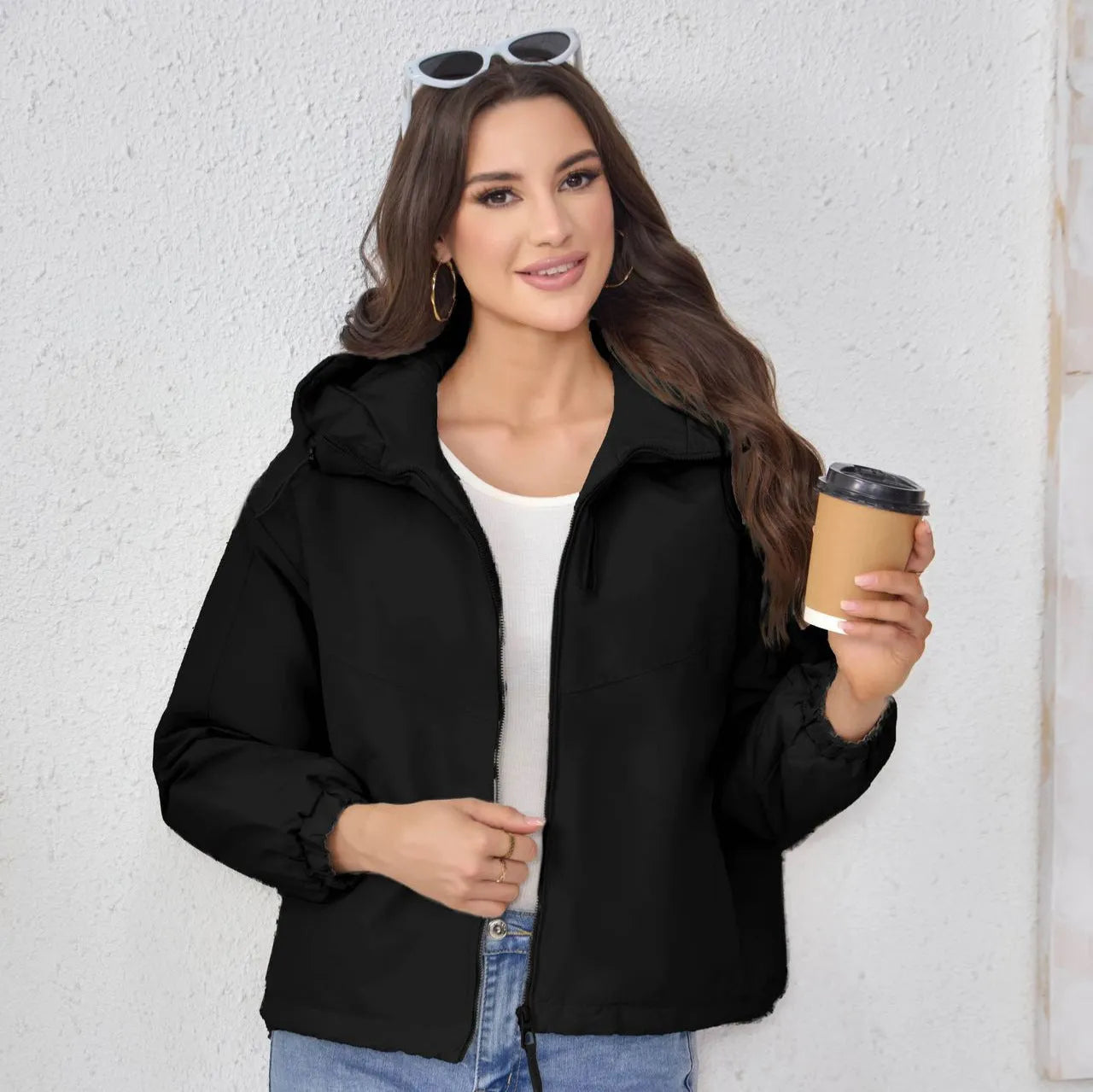 A woman's loose-fit hooded jacket in solid-colour polyester, shown in grey.