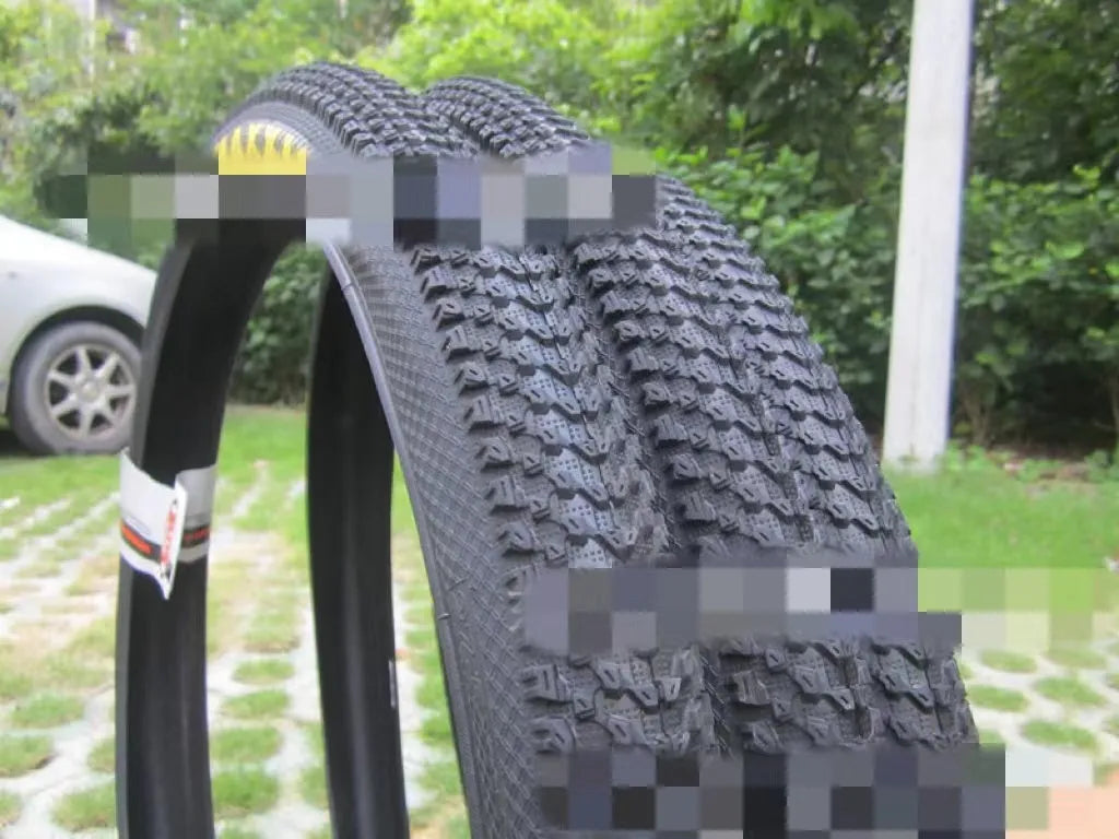 Ultralight puncture proof mountain bike tyre shown in 26, 27.5, and 29 inch sizes with black and white label sidewall options.