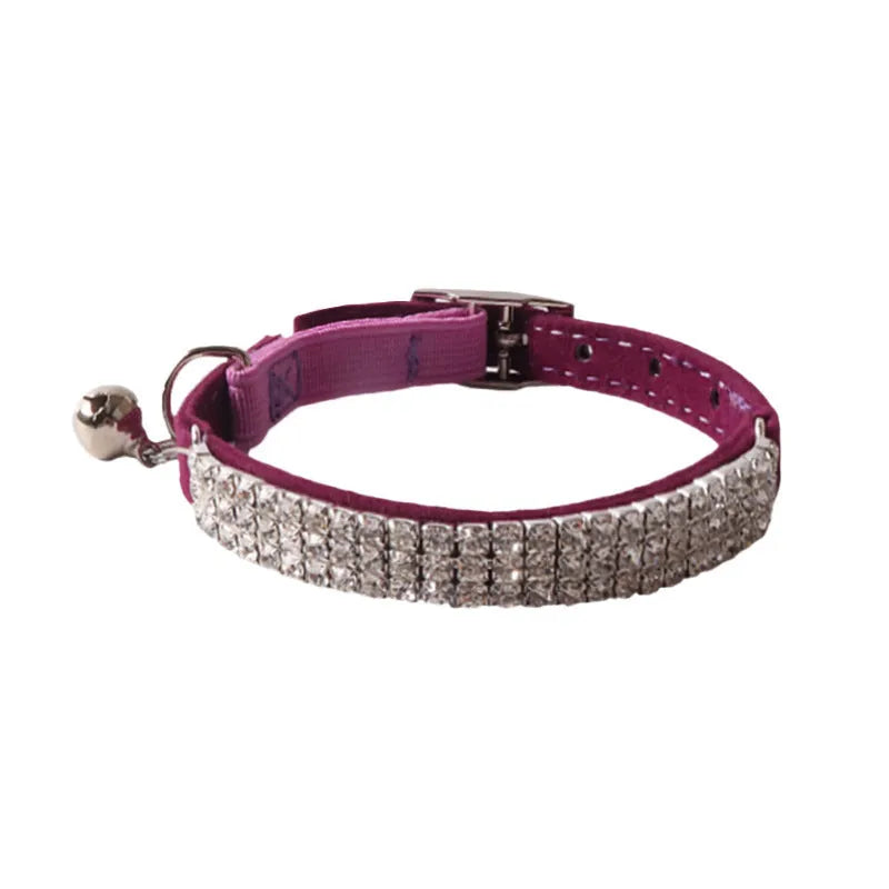 Soft pink flocked cat collar with a plastic buckle on a 28cm elastic band, showing gang drill holes for tags.