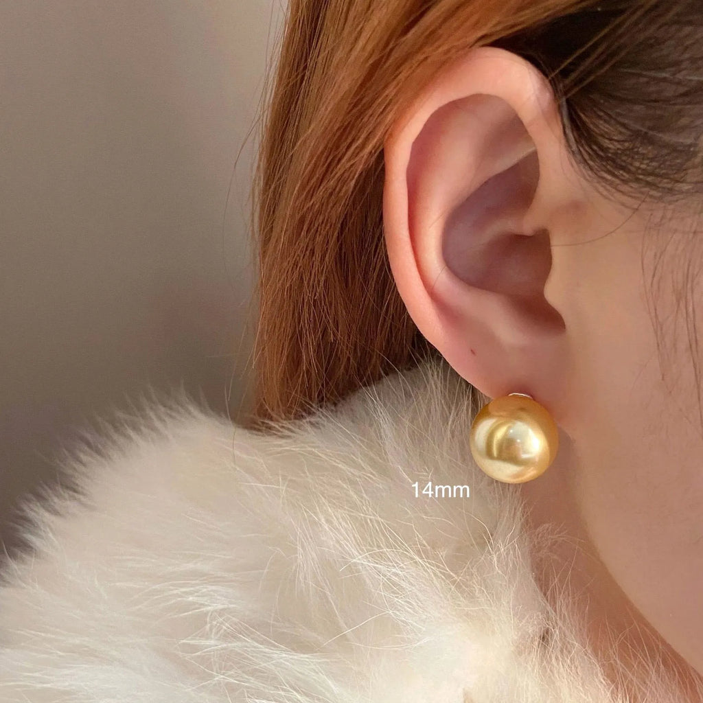 Retro geometric pearl stud earrings for women with an eight-point star design on silver setting.