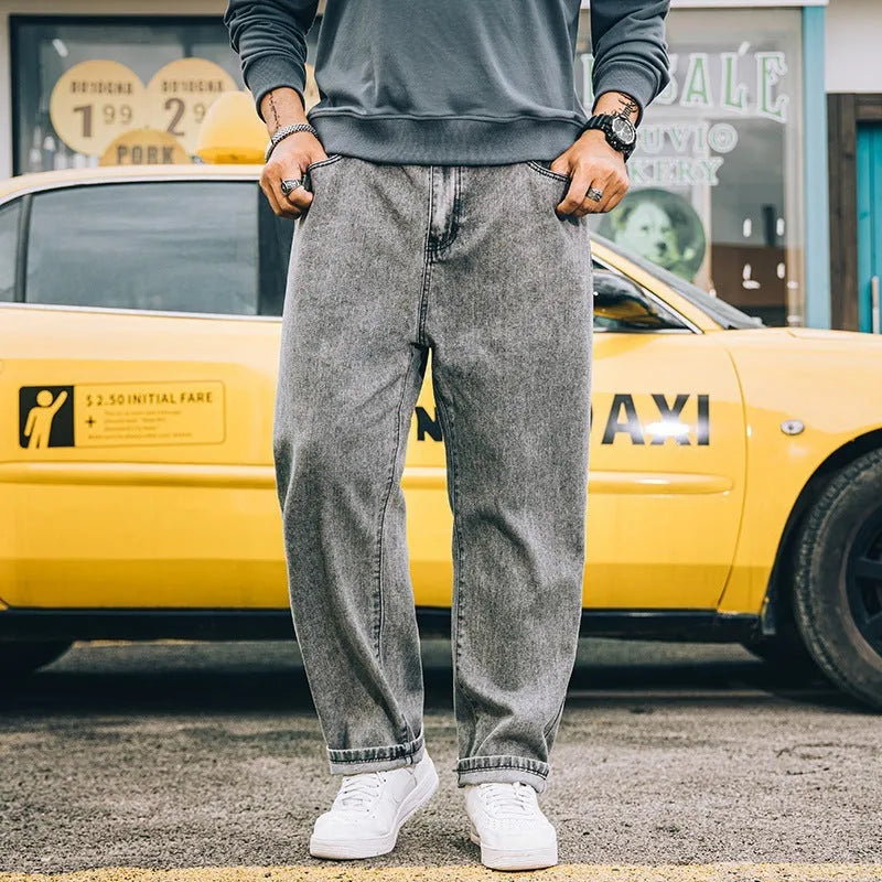 Men's loose straight leg casual jeans in cotton, shown in dark blue, light blue, and grey colours.