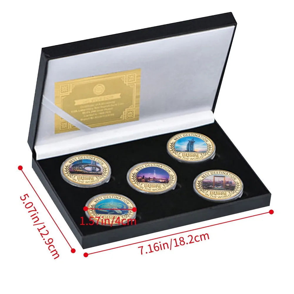 Five iron commemorative coins with Dubai building designs in a gift box