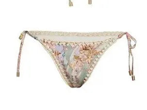 Women's creamy-white floral nylon bikini set with detachable skirt shown in sizes S-XXL