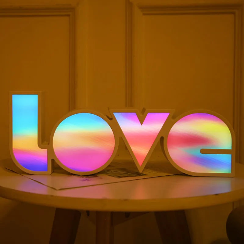 LED LOVE light decoration with rainbow-style lampshade showing romantic room illumination