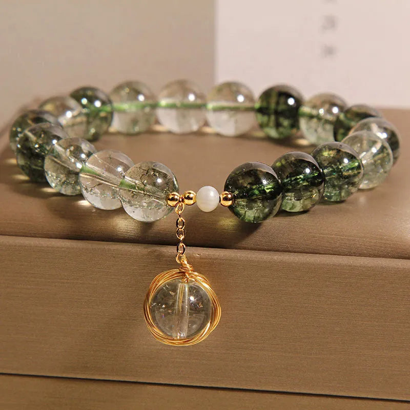 Green phantom quartz and chorite crystal bracelet with winding transfer beads