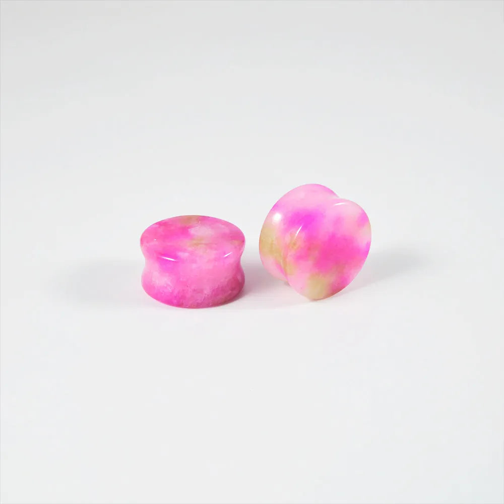 Crystal red flower stone solid expansion earplug on grey background, 6mm to 30mm sizes available, unisex geometric design