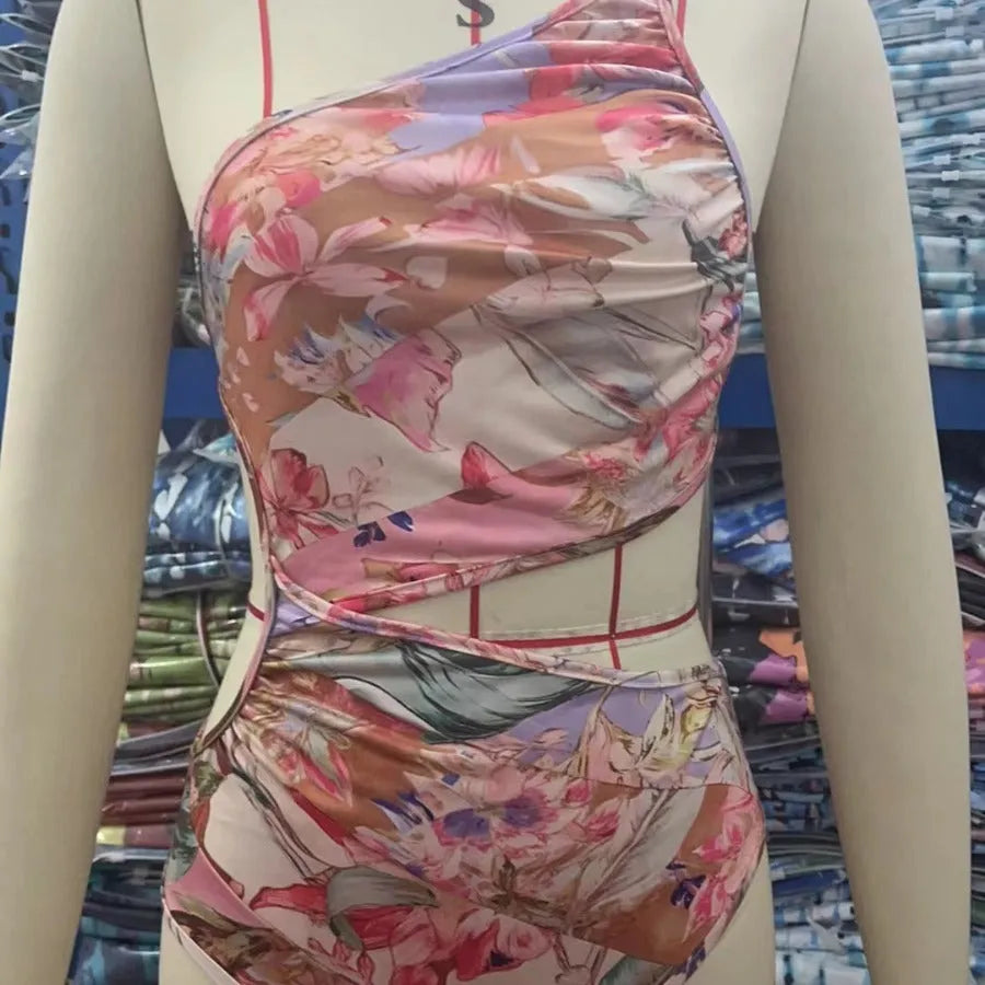 Women's rose gold patterned swimsuit in polyester fabric showing front design