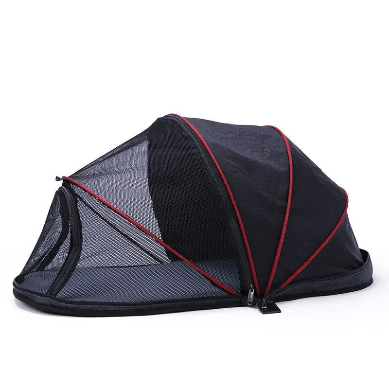 Portable black and mesh folding tent for cats shown set up as a pet bed and travel cage.