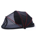 Portable black and mesh folding tent for cats shown set up as a pet bed and travel cage.