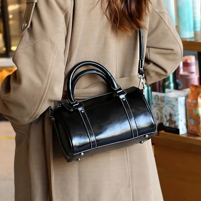 Cortex lady casual zip crossbody bag in top grain leather, cylindrical shape, shown in available colours