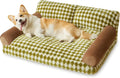 Checkered grey and white pet sofa bed for small dog or cat on wooden floor.