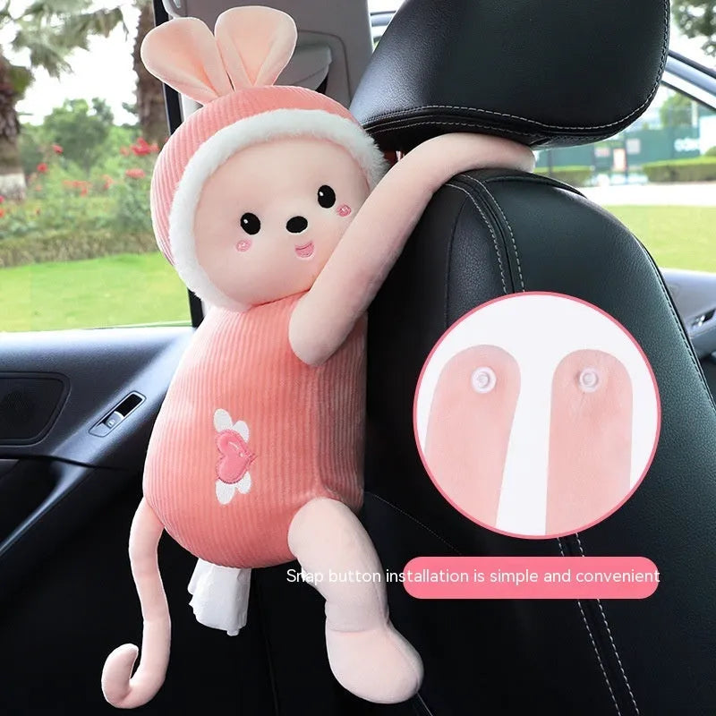Soft plush car headrest tissue box holder in a cute animal character style.