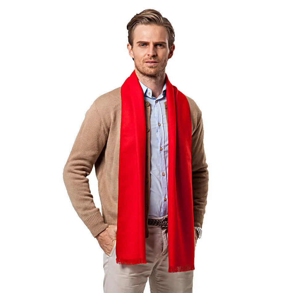 Men's solid red double-sided velvet scarf with tassel ends on a neutral background