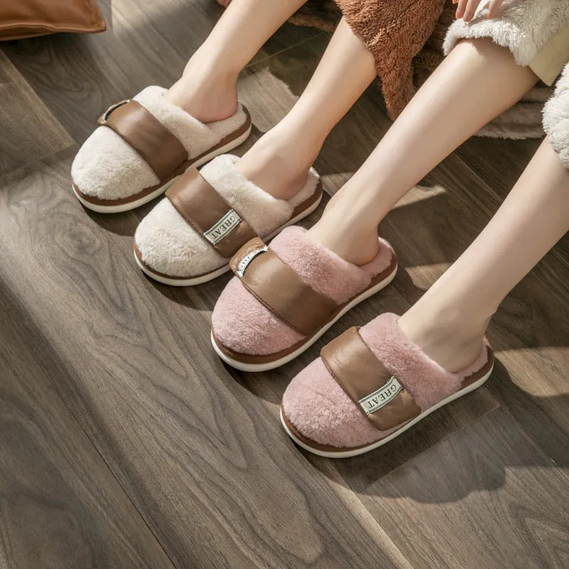Women's beige plush floor slippers with round toe, flanging detail, and textured plastic sole.