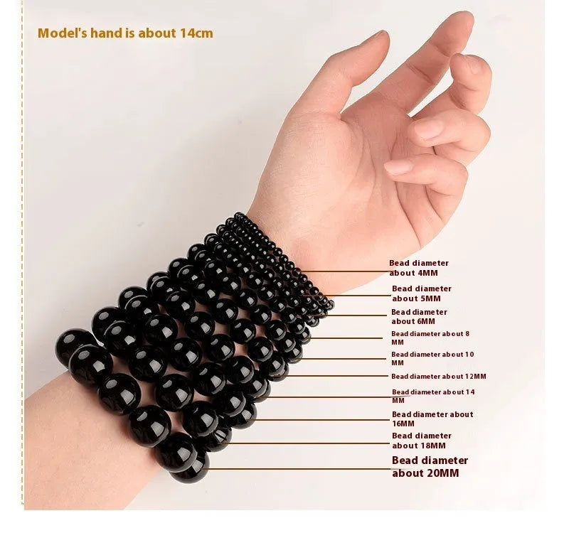 Straight cut Hetian jade bracelet in natural smokey violet colour on a wrist, showing polished 8x9mm beads.