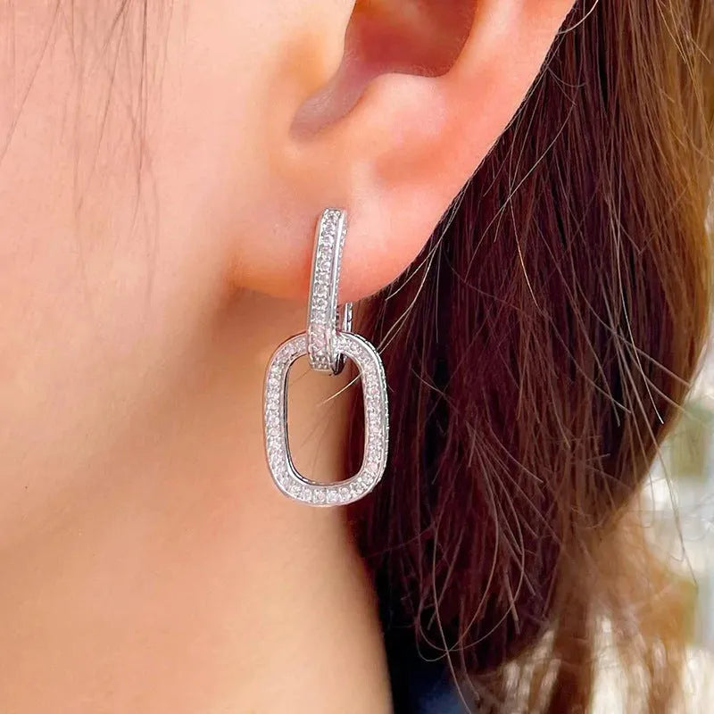 U-shaped geometric copper earrings for women with inlaid zircon, shown in white gold colour and yellow gold colour options.