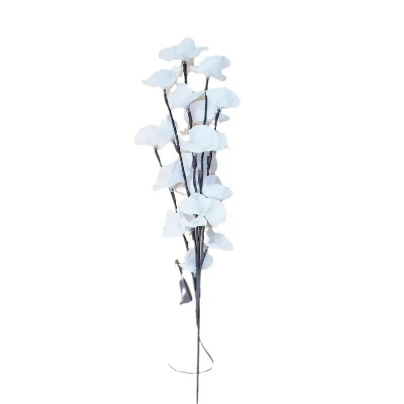 Pink silk orchid LED branch light, 65cm long, with glowing warm white LEDs on fabric petals and plastic stem.