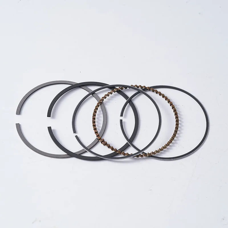 Motorcycle engine piston kit showing aluminium piston, rings, and pin for 57.4mm cylinder diameter