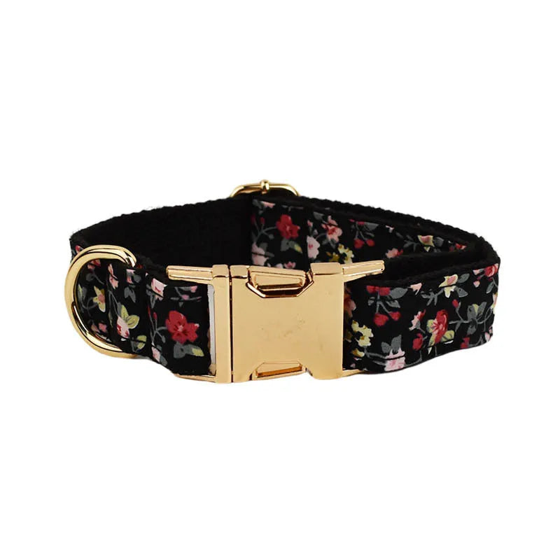 Four-piece pet accessory set with dog collar, leash, removable bow, and printed vest in cloth material