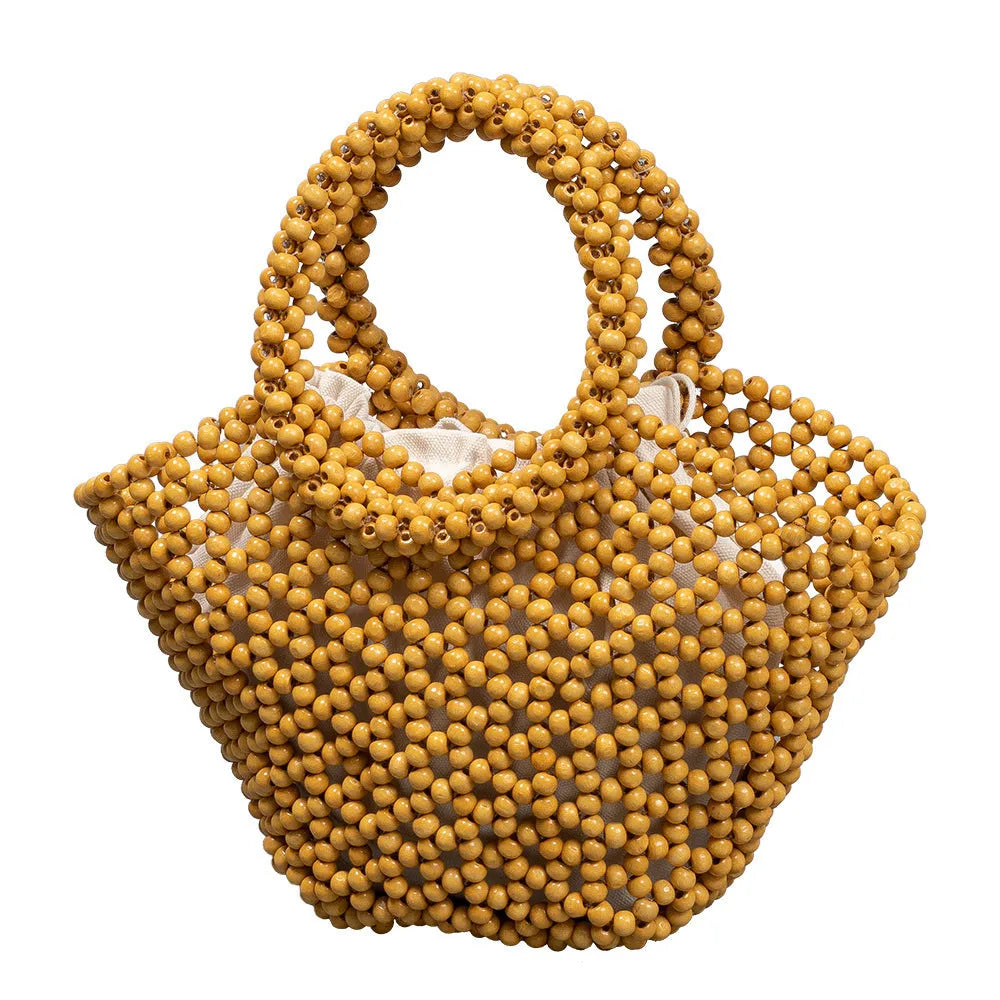 Hand-woven maple wood hollow handbag with wooden bead decoration in dumpling shape