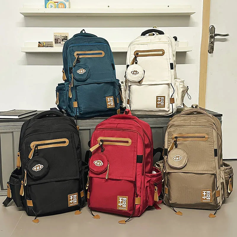 Large capacity waterproof nylon travel backpack with contrast stitching in beige colour option