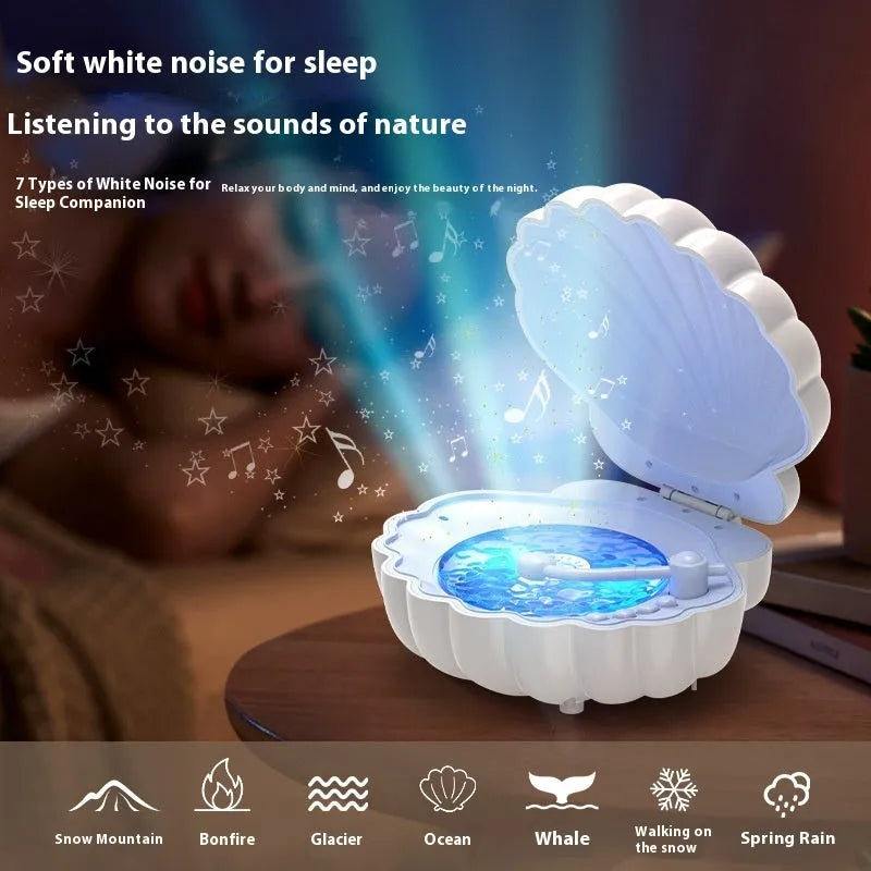 Retro vinyl record player shaped shell lamp with integrated speaker, shown in blue colour on a wooden table.