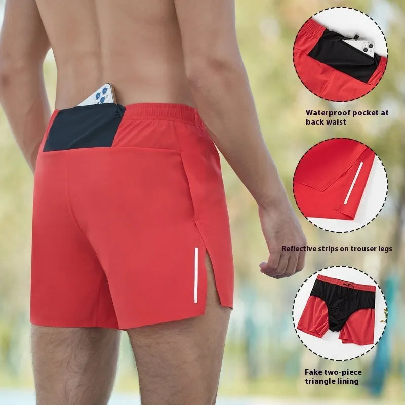 Man wearing high-waisted grey off-road running shorts, showing loose fit and athletic design.