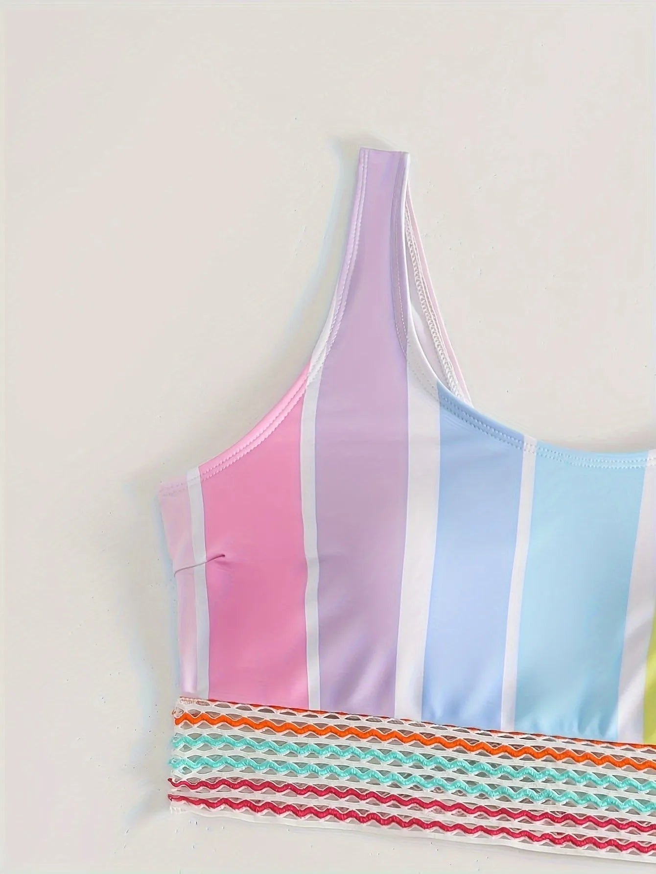 Women's striped sports bikini top and briefs on a mannequin, showing the European and American style pattern.