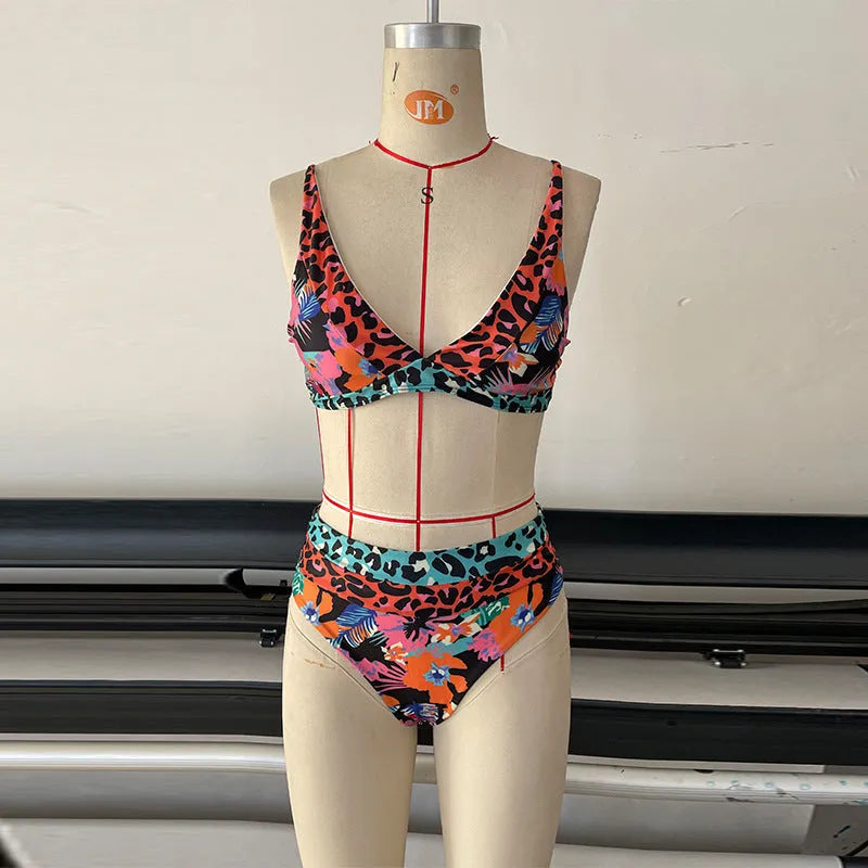 Women's high-waist floral print bikini set in blue on a mannequin.