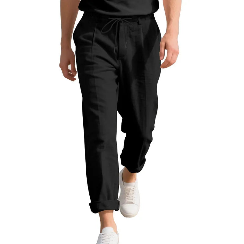 Men's light khaki linen casual trousers with drawstring waist on a hanger.